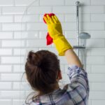 House cleaning. Woman is cleaning in the bathroom at home